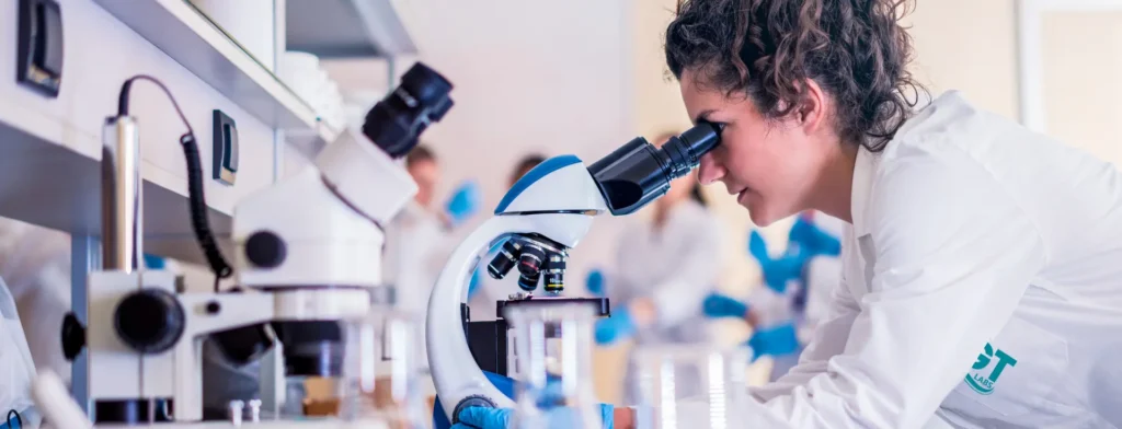 AGT Labs scientist seeing the testing particle through the microscope