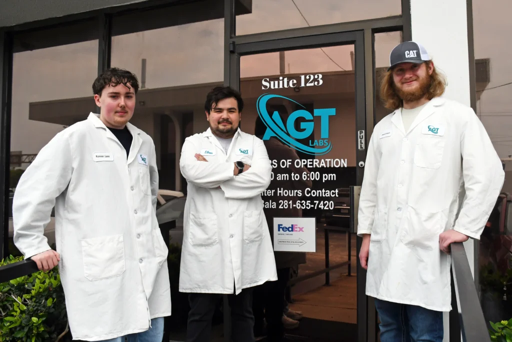 AGT interns standing outside of front door