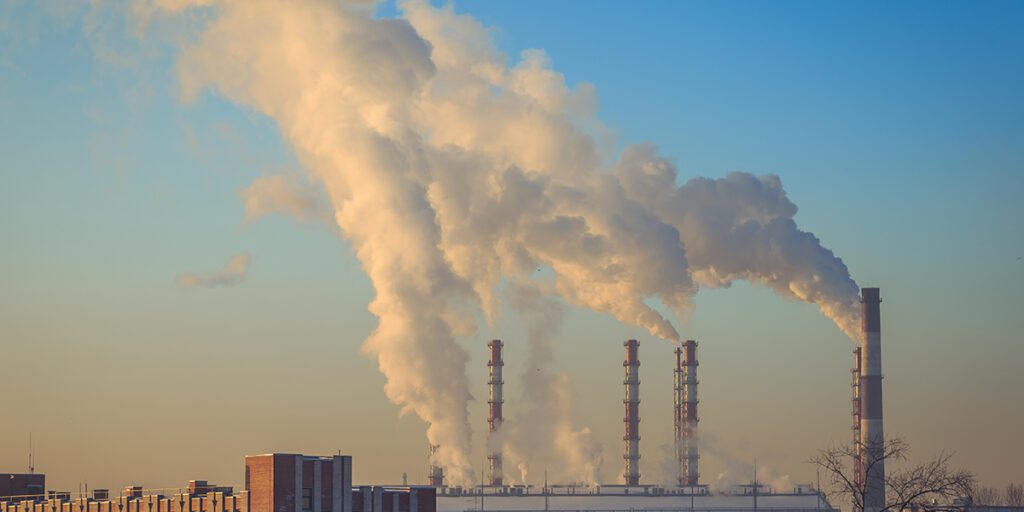 Smoke From The Pipes Of The Factory In Winter